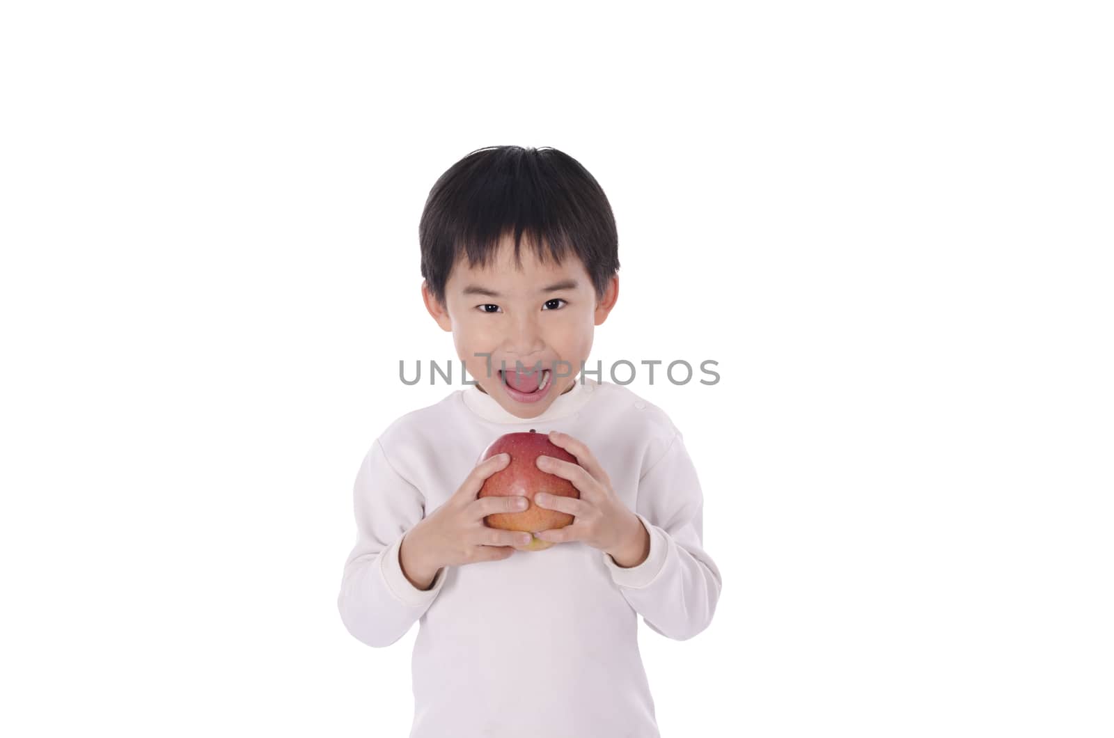 Cute little boy eating an apple with white background