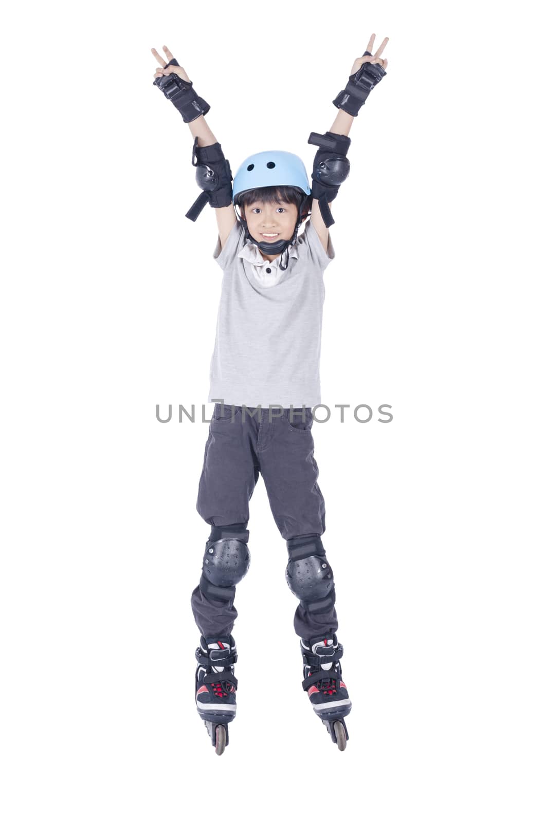 Smart boy playing roller blades over white background