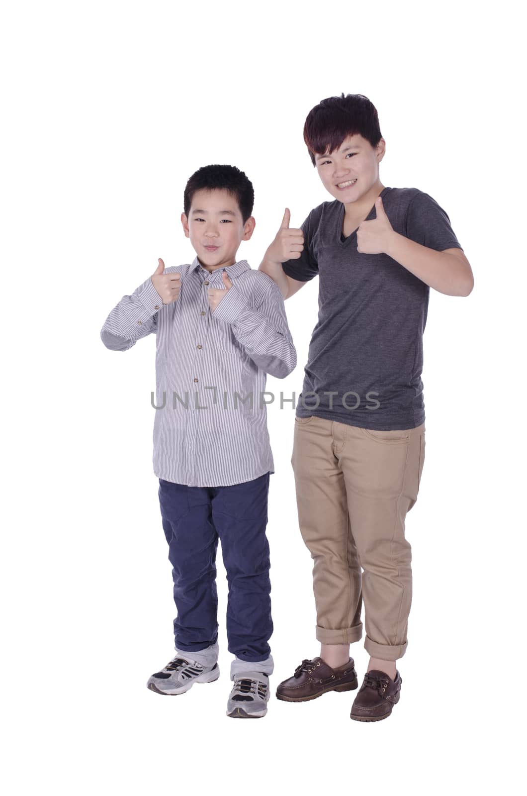 Two teenagers gives the thumbs up with white background