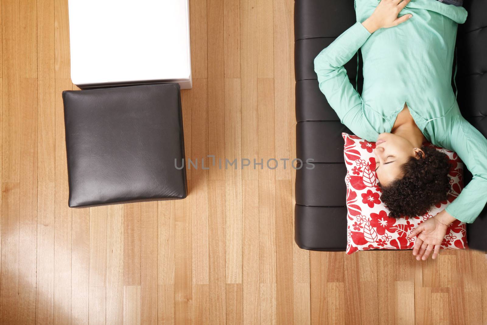 A jung brazilian woman sleeping on the sofa.