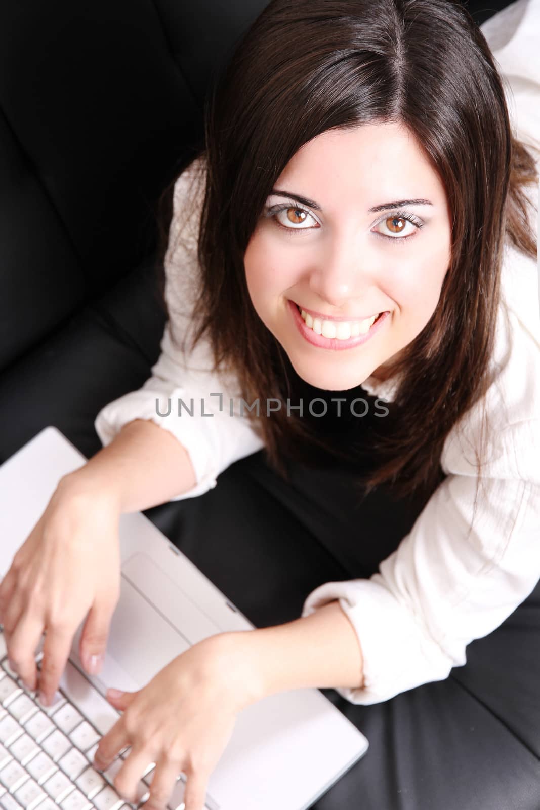 Young Hispanic Woman surfing on the Sofa  by Spectral