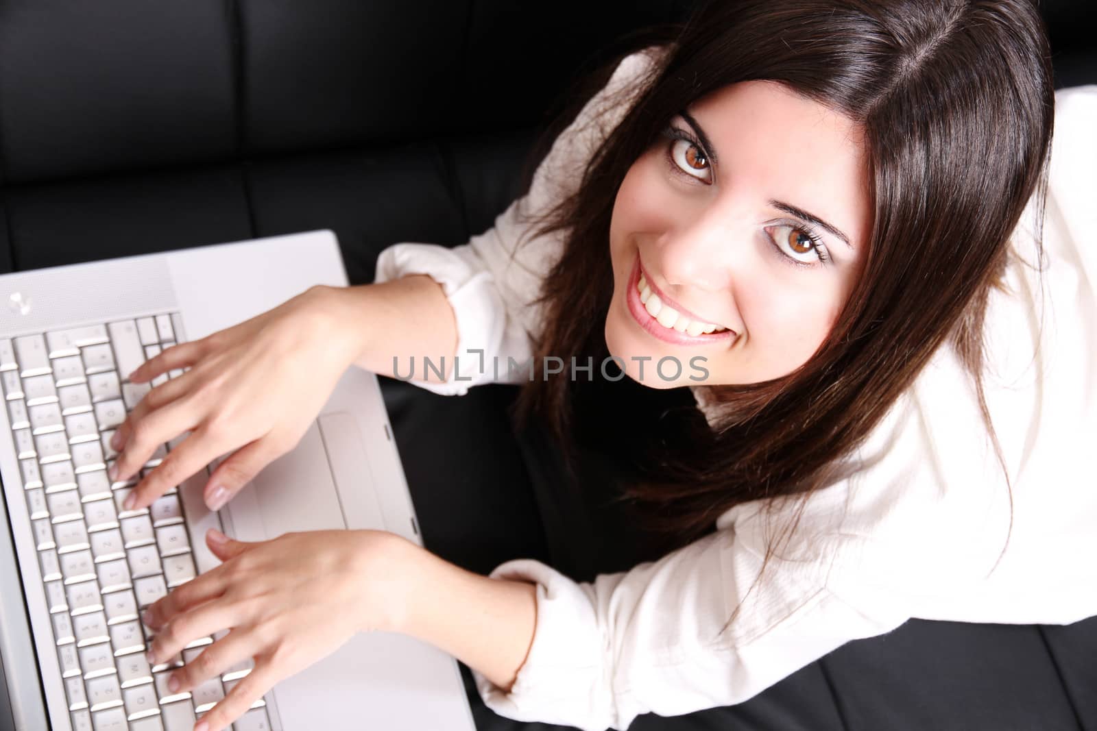 Young Hispanic Woman surfing on the Sofa by Spectral