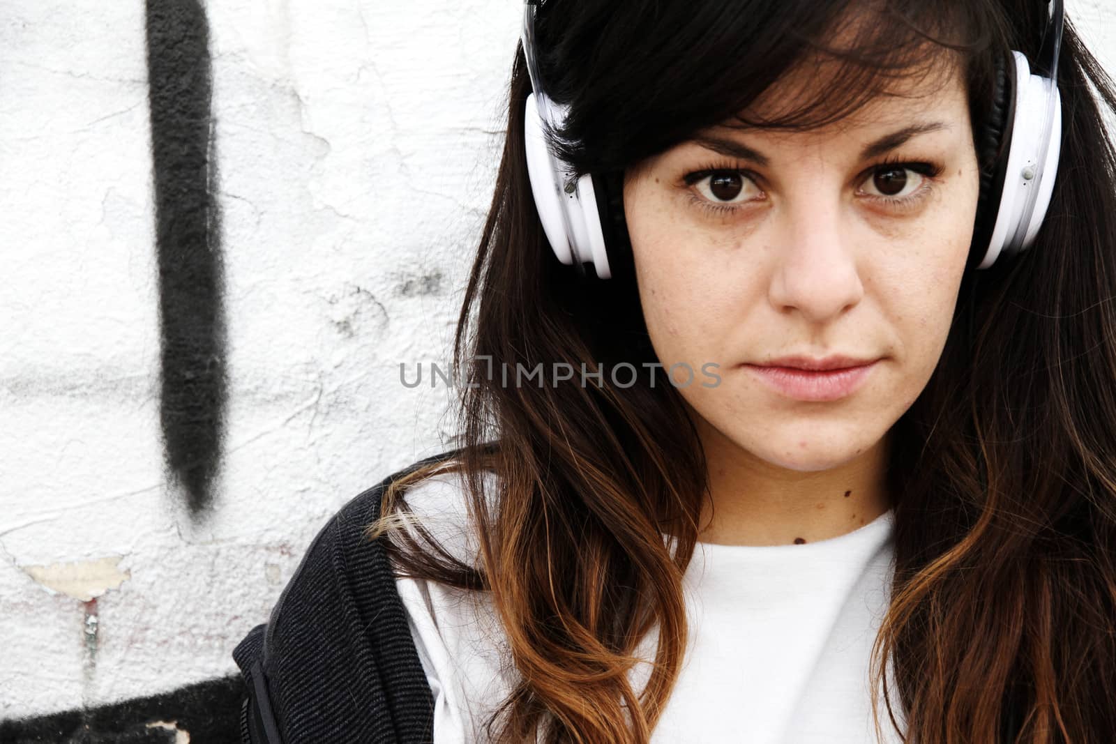 Girl listening to Music while leaning on a Wall by Spectral