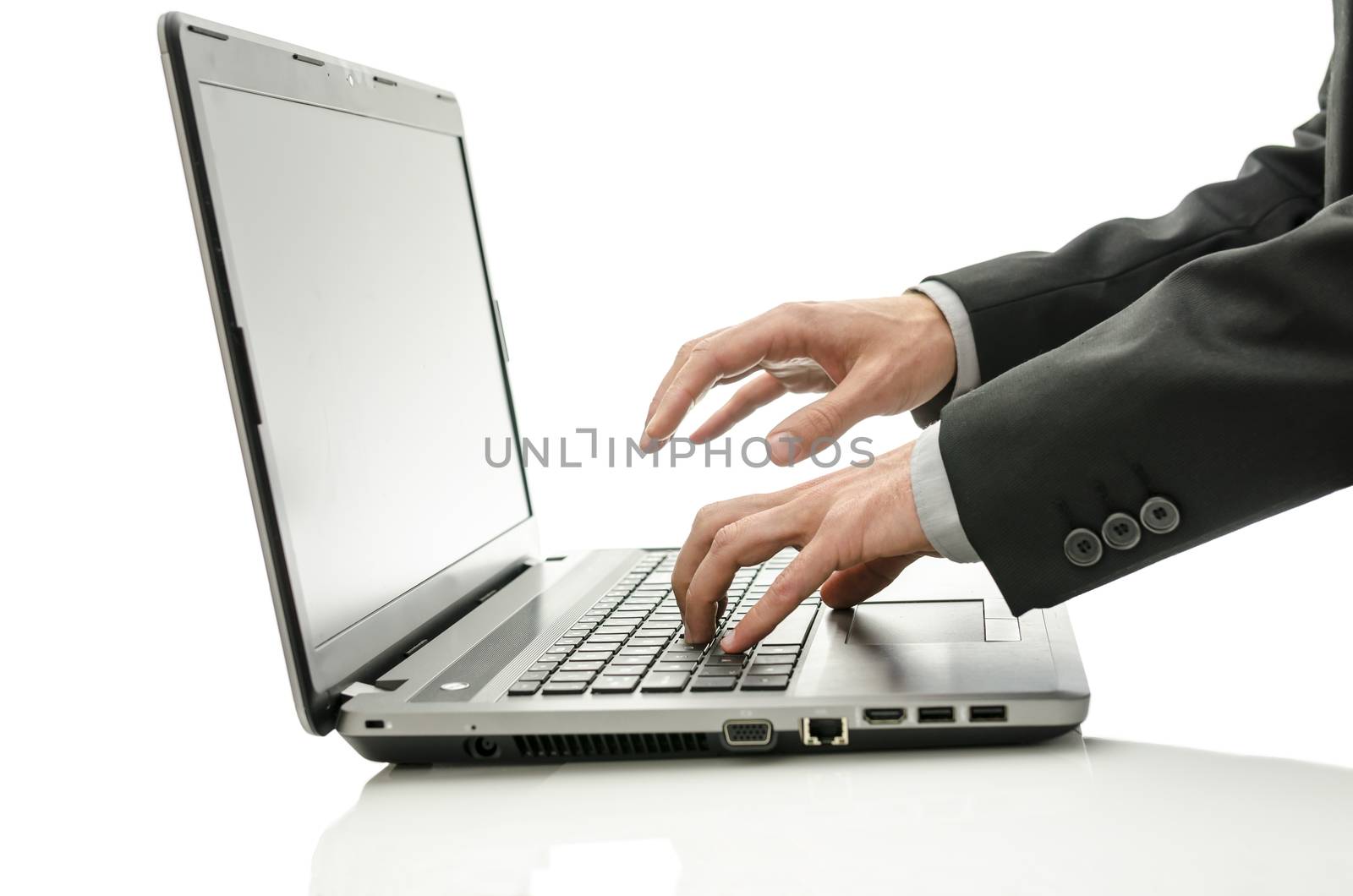 Close up of businessman working on laptop.
