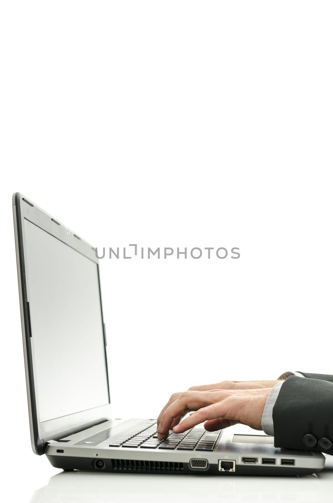 Closeup of business man hands typing on laptop.