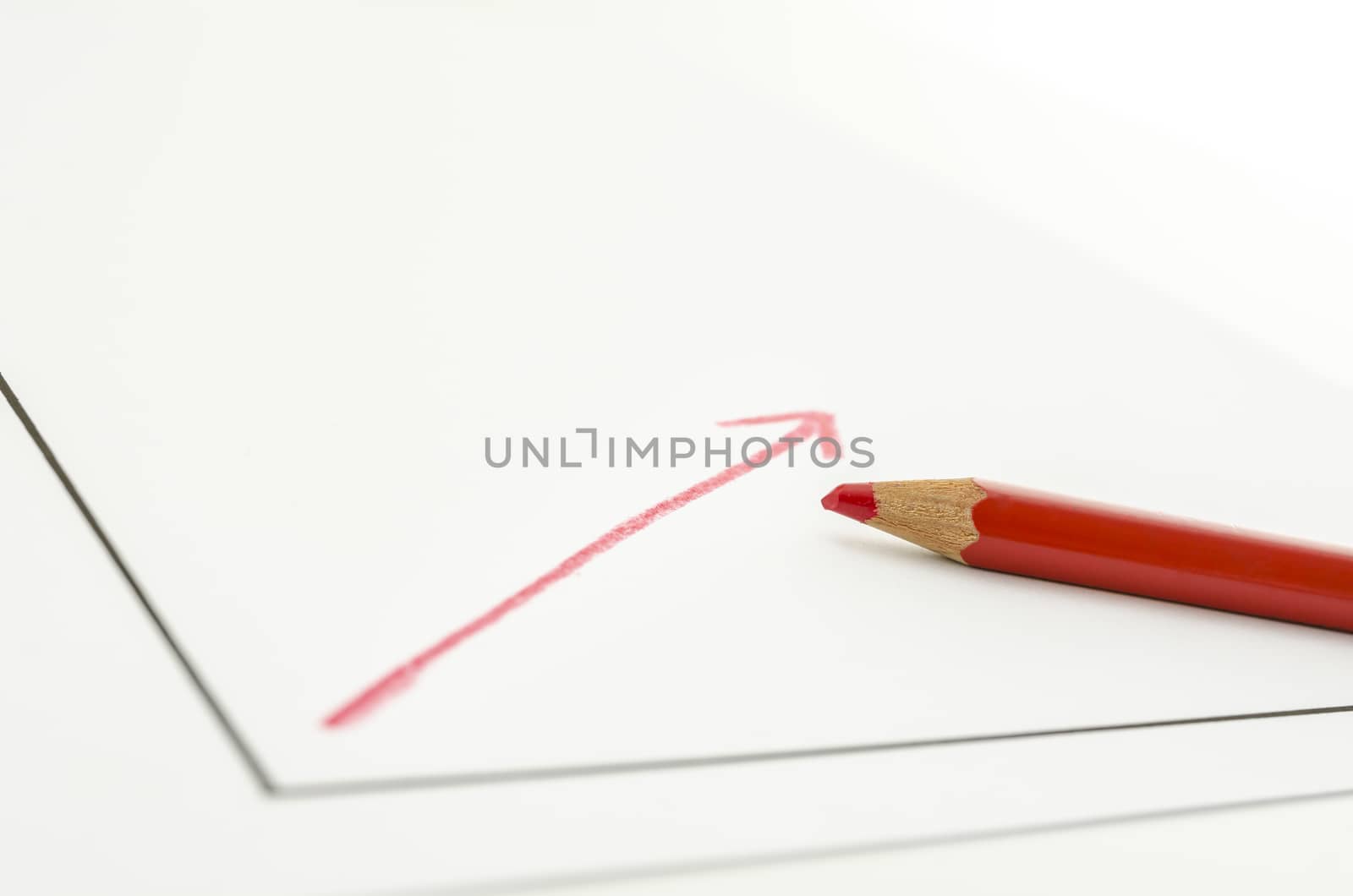 Growing graph and red pencil.