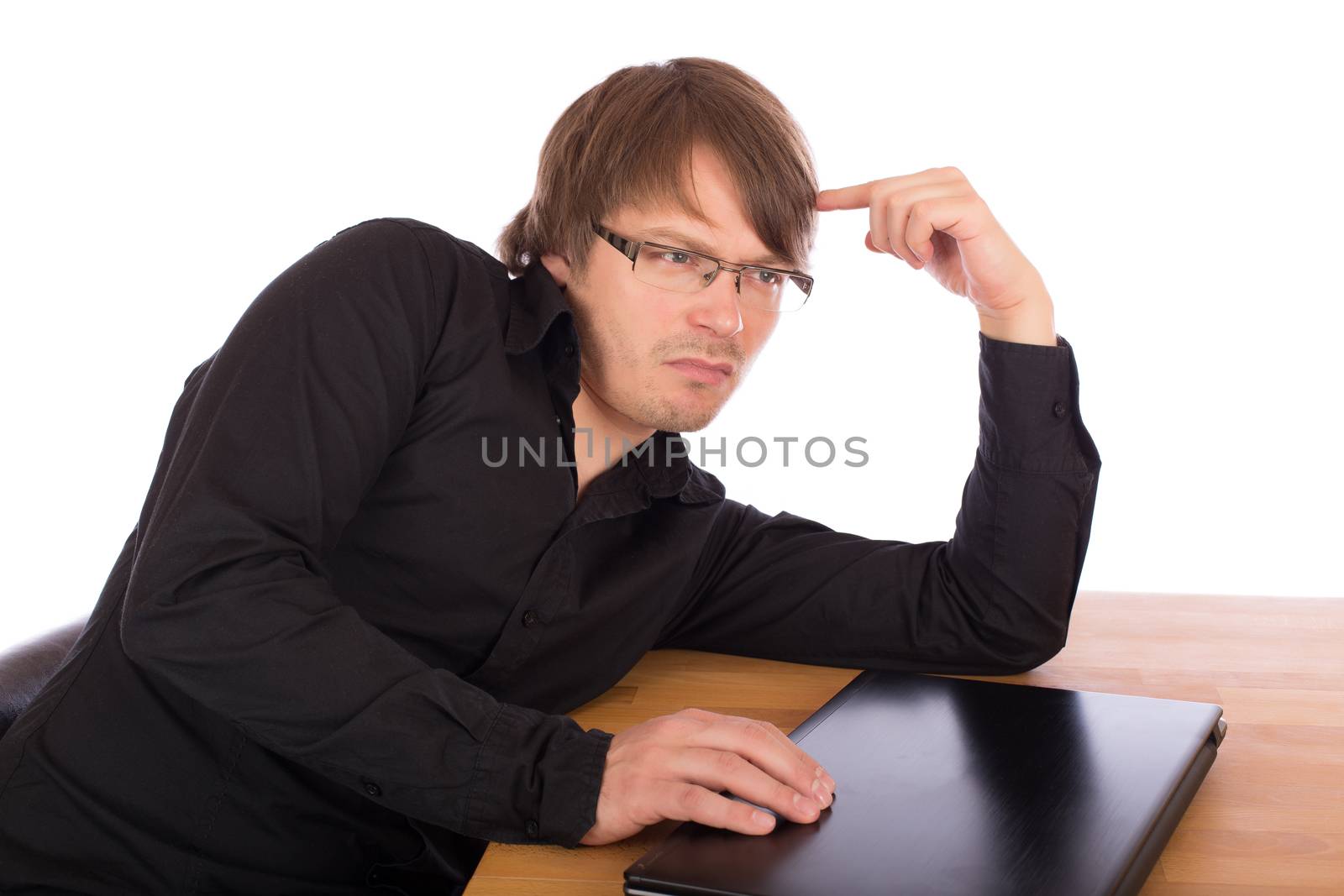 Business man sitting at a table and think seriously about a business idea. Isolated on white background.