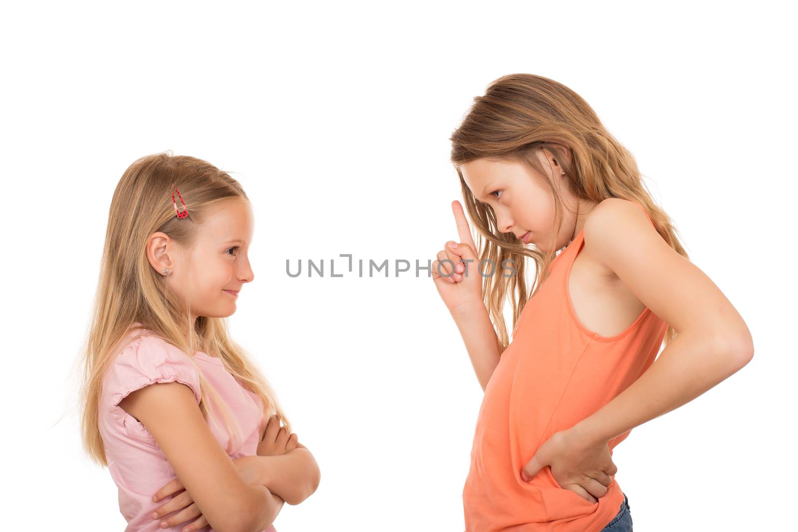 Big sister disagree pointing finger at her little sister because she did a silly, foolish, stupid thing or something wrong. Isolated on white background.