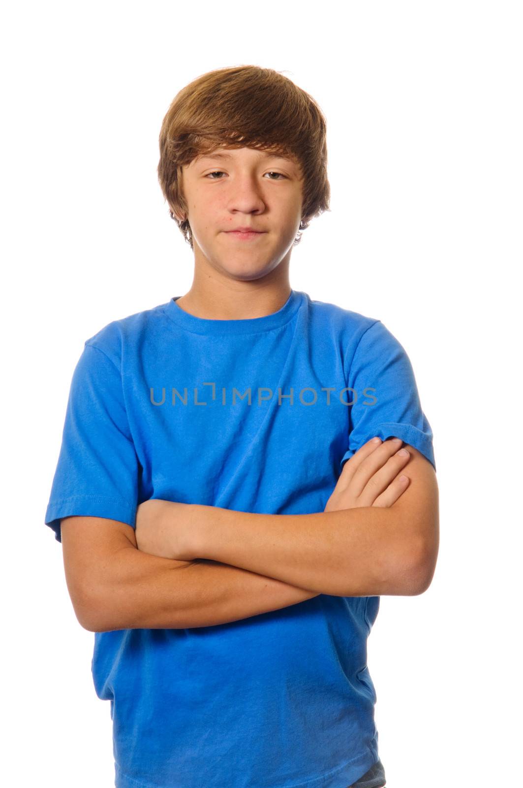 Young teen caucasian boy with arms crossed isolated on white background.