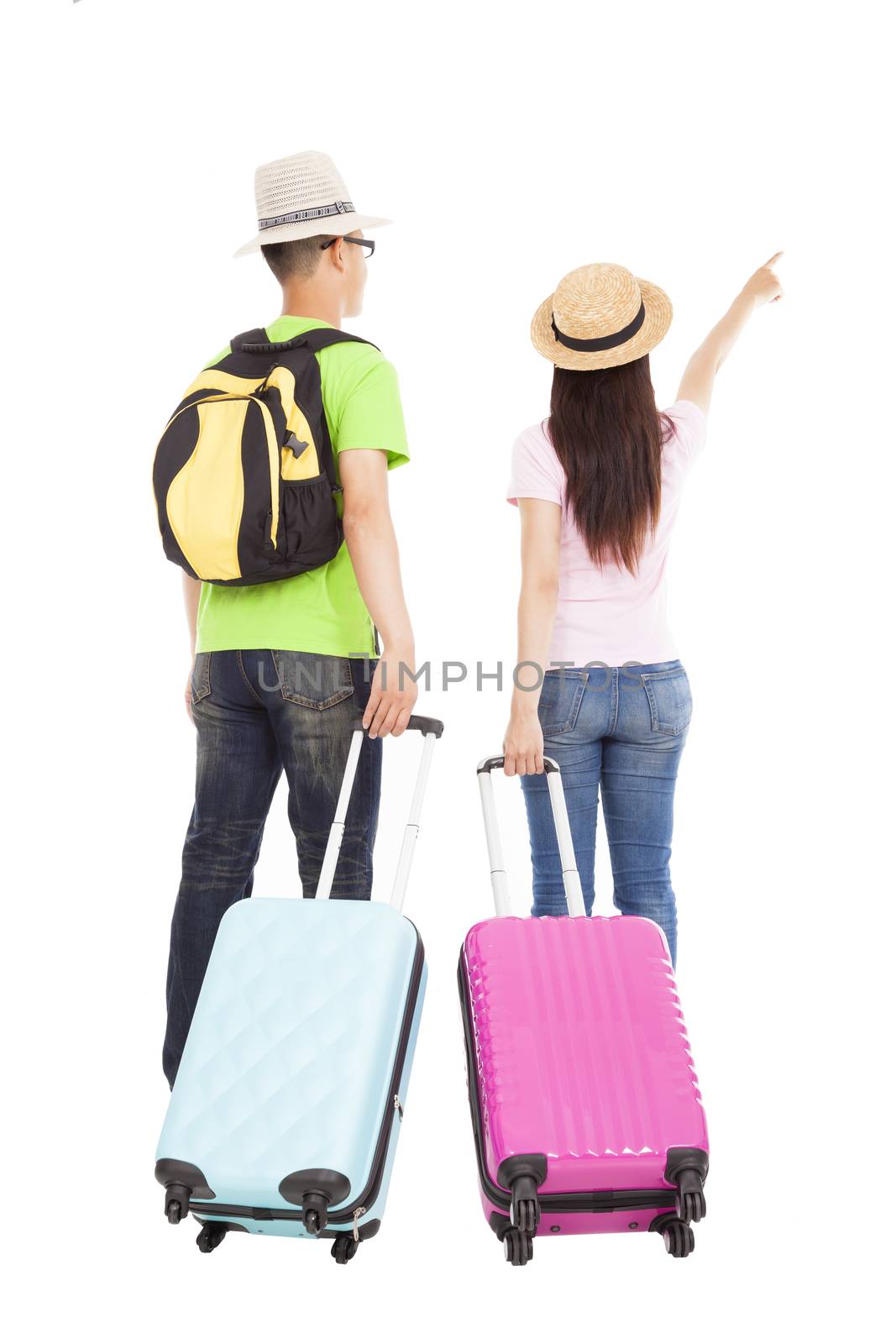 happy couple tourist with travel suitcase and pointing something by tomwang