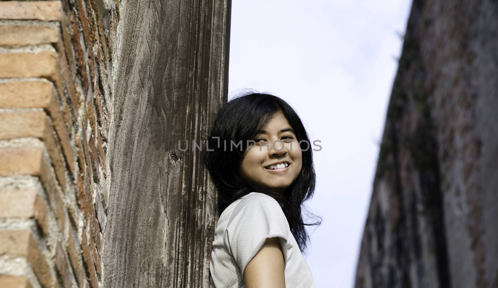 Beautiful young girl at Wat Maheyong Temple by siraanamwong