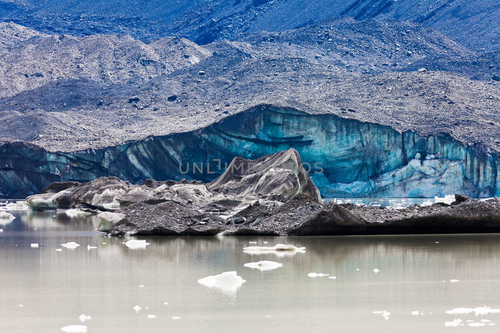 Tasman Glacier ends at Lake with floating icebergs in Aoraki Mount Cook National Park on South Island of in New Zealand