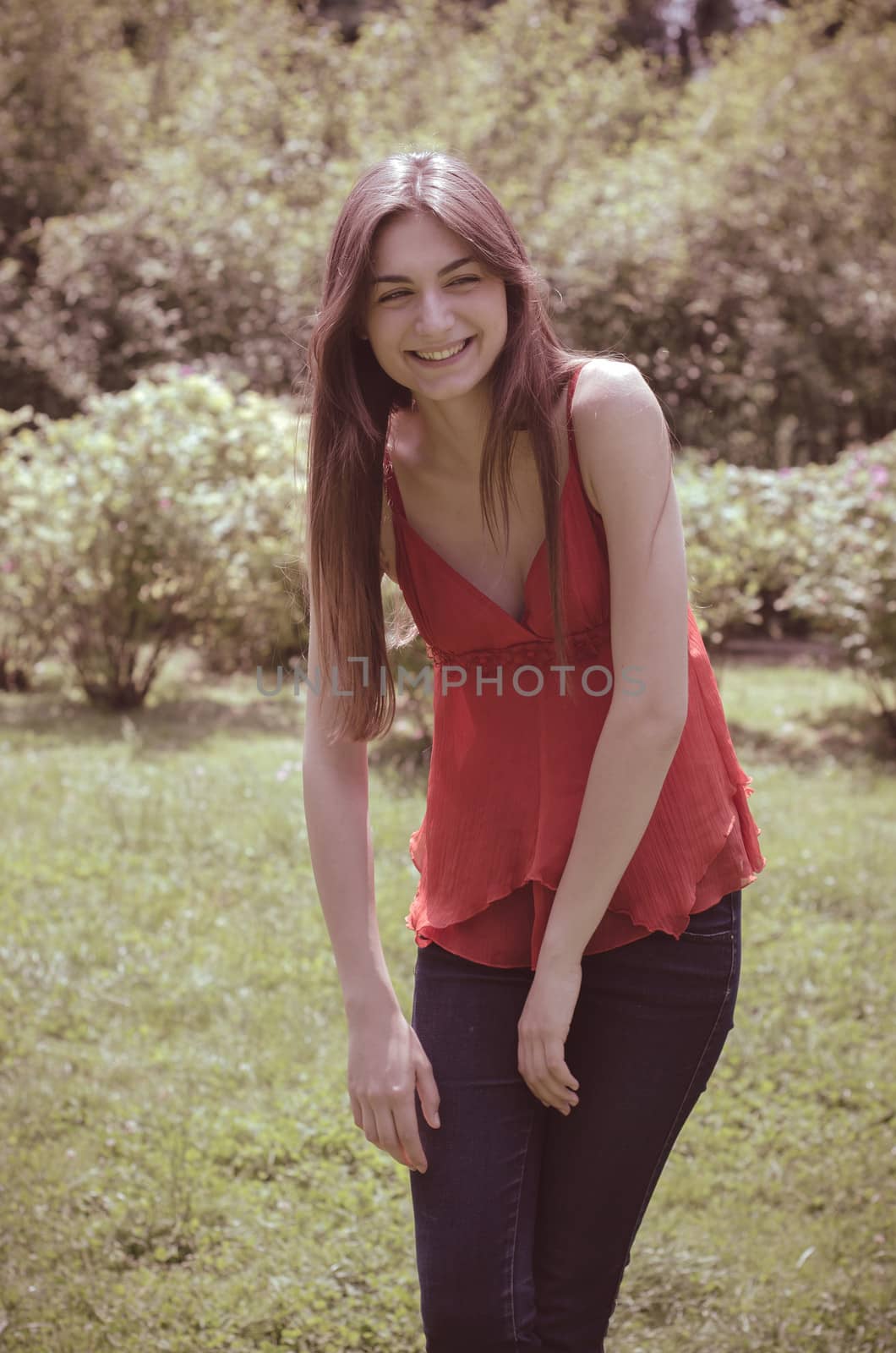 beautiful model young woman in the park in spring