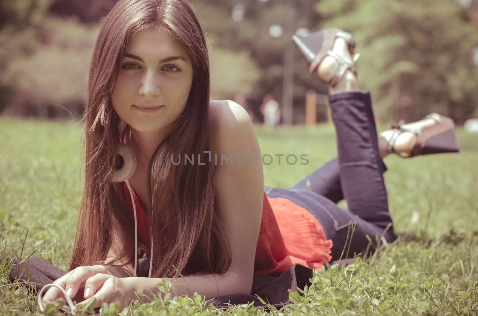 beautiful model young woman in the park in spring