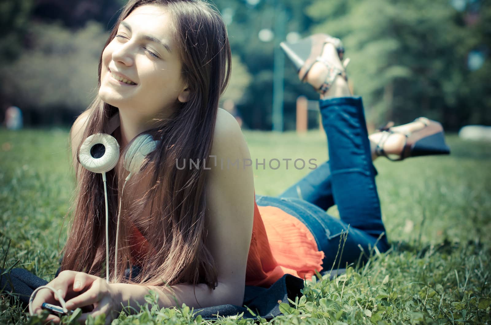 beautiful model young woman in the park in spring