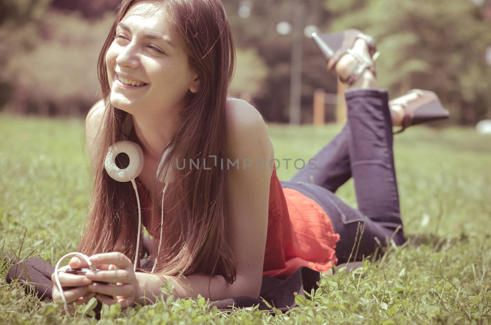 beautiful model young woman in the park in spring