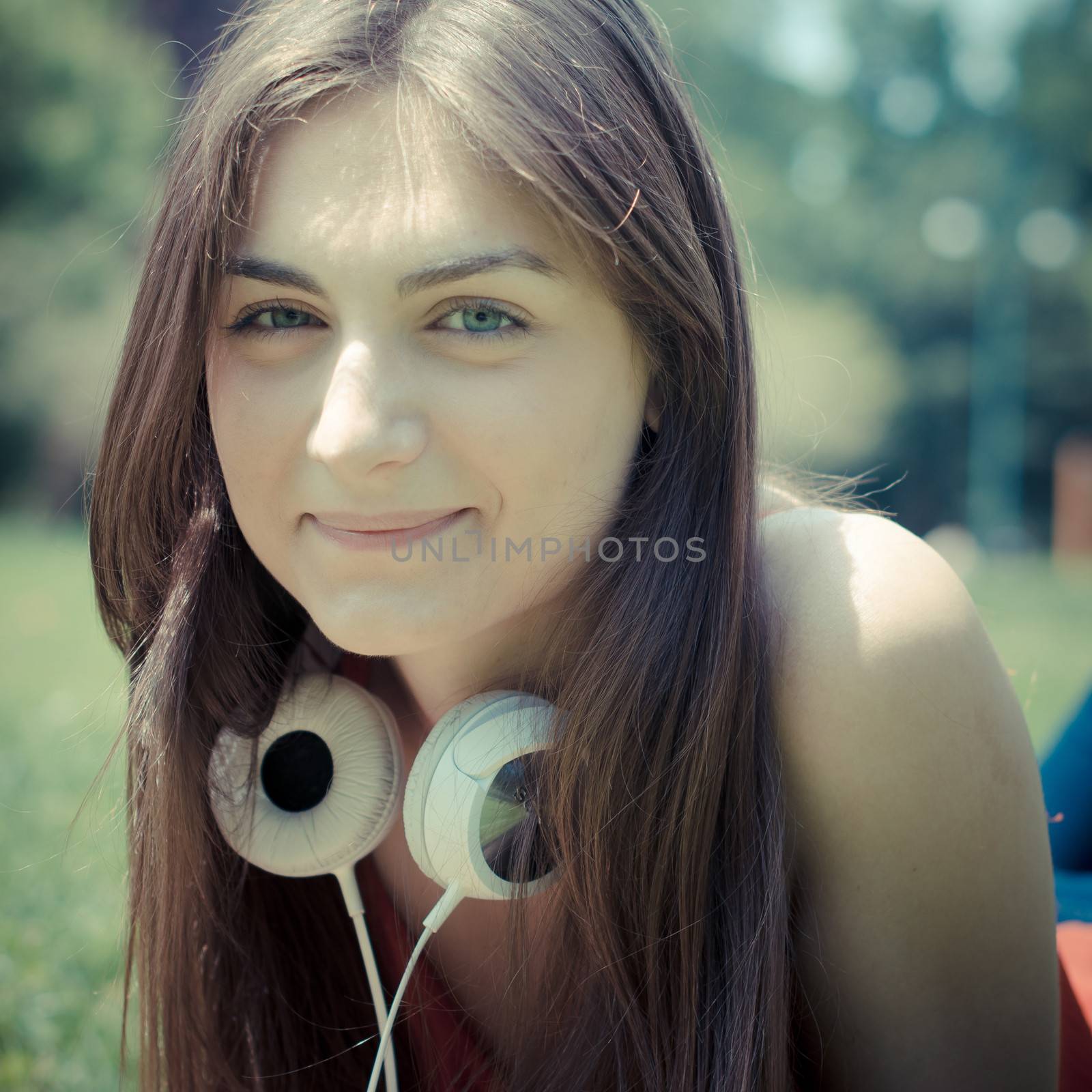 beautiful model young woman in the park by peus