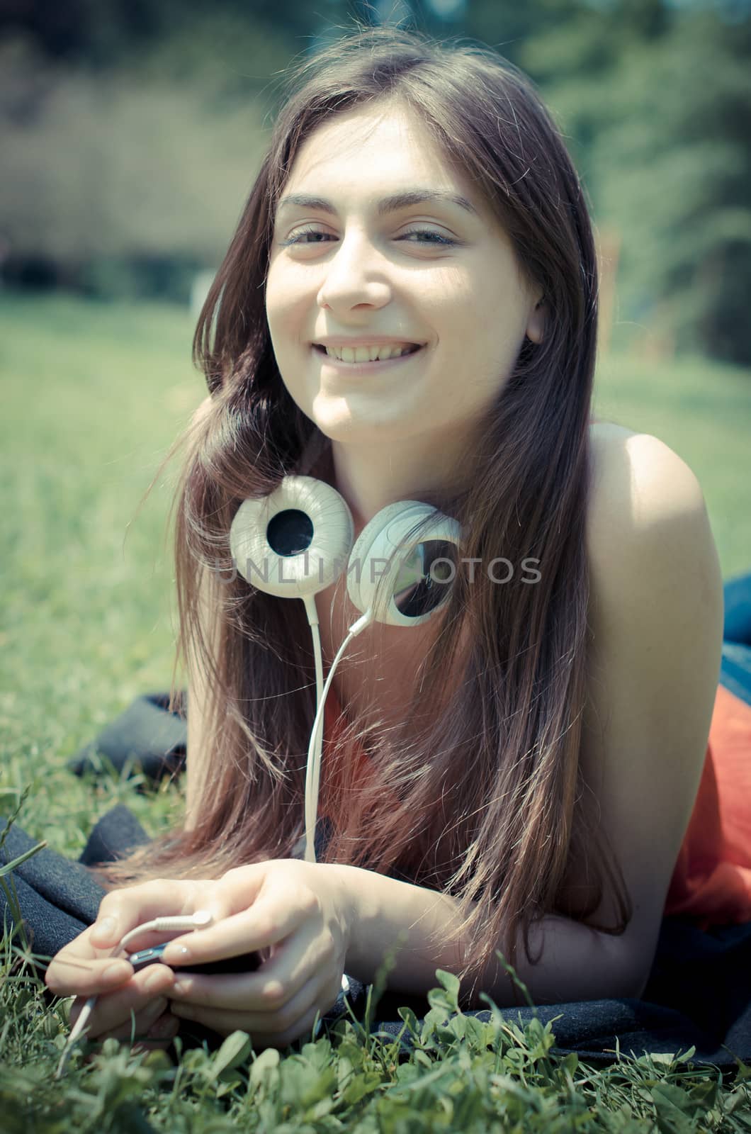 beautiful model young woman in the park in spring