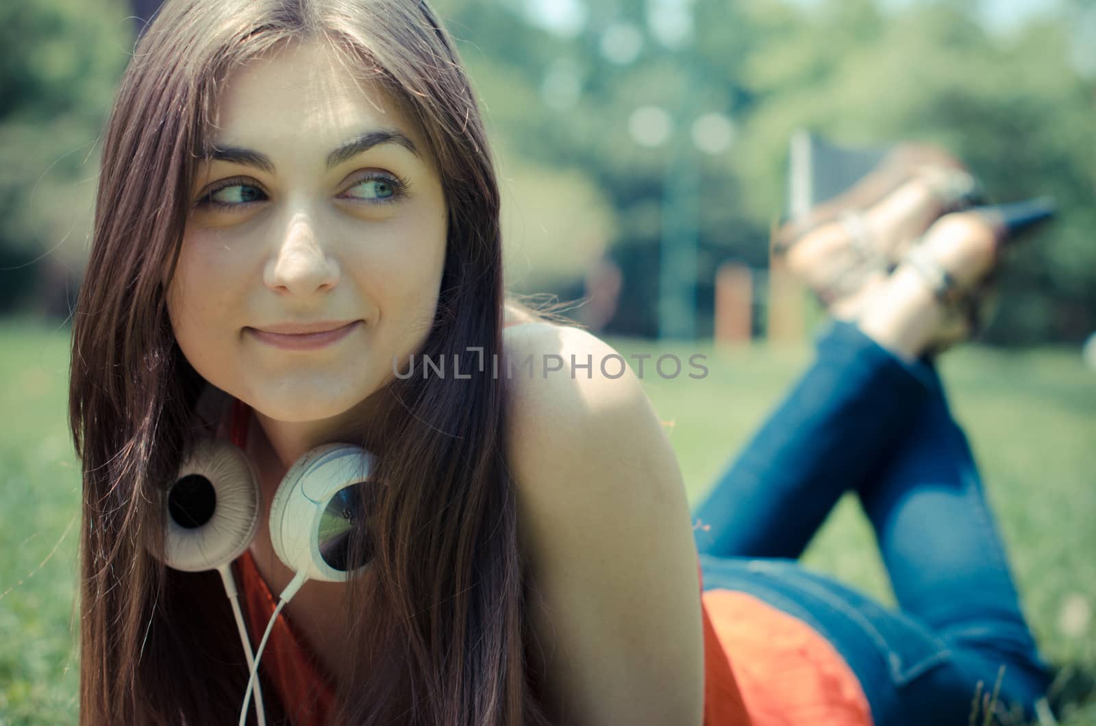 beautiful model young woman in the park in spring