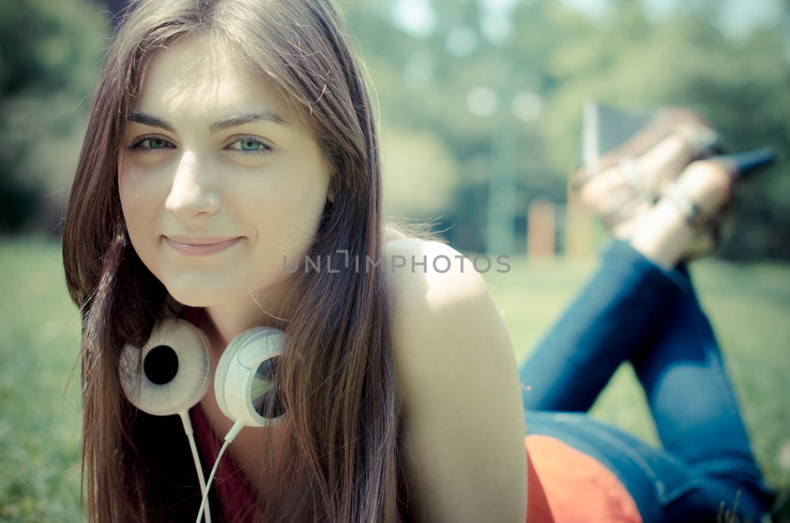 beautiful model young woman in the park in spring