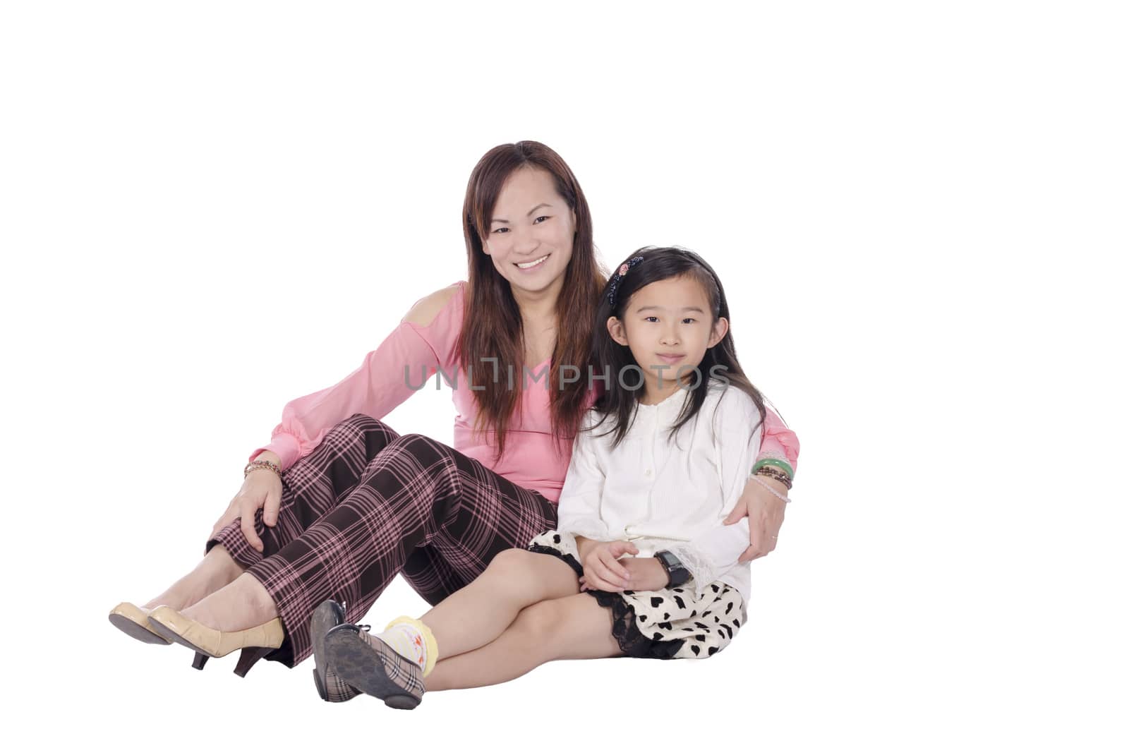 mother and daughter over white background