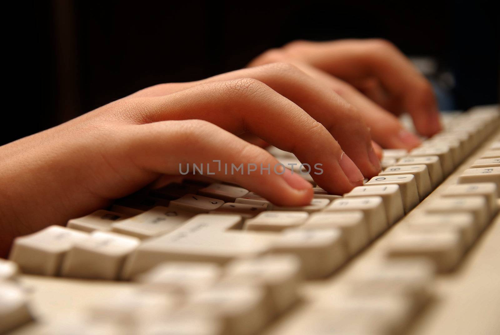 Photo of hands working on a keyboard in the internet