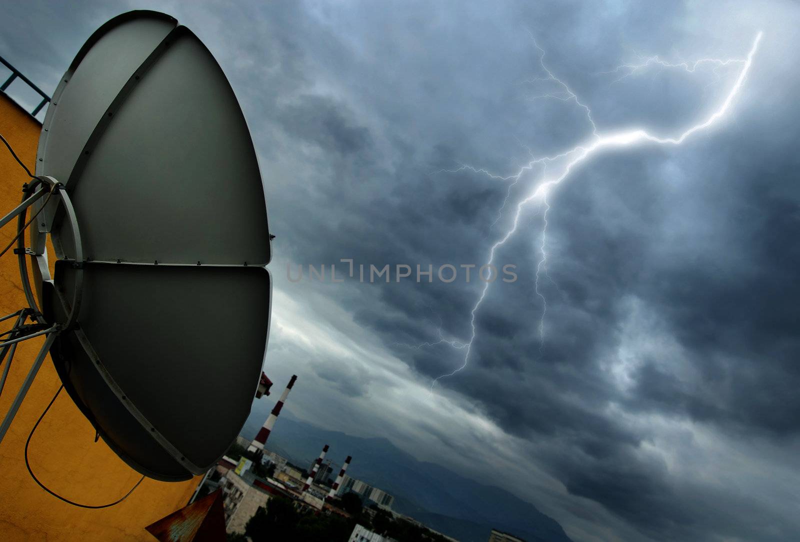 Creative photo of the high-tech parabolic antenna and lightning