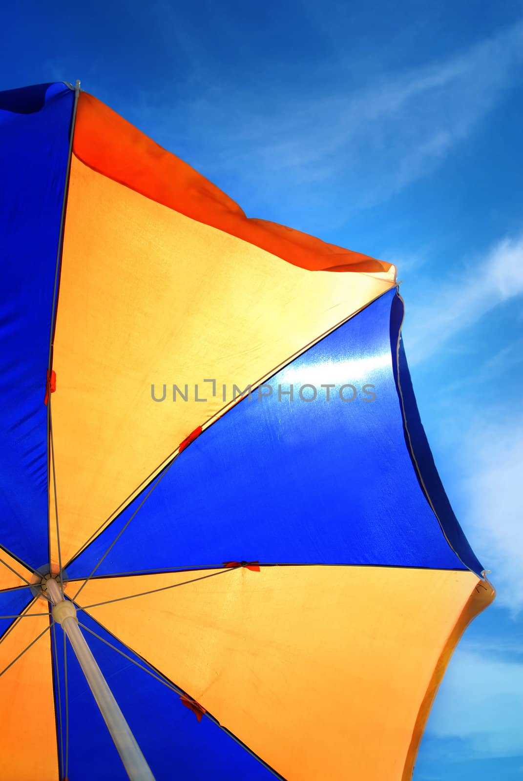 Close-up photo of the beach umbrella on blue sky