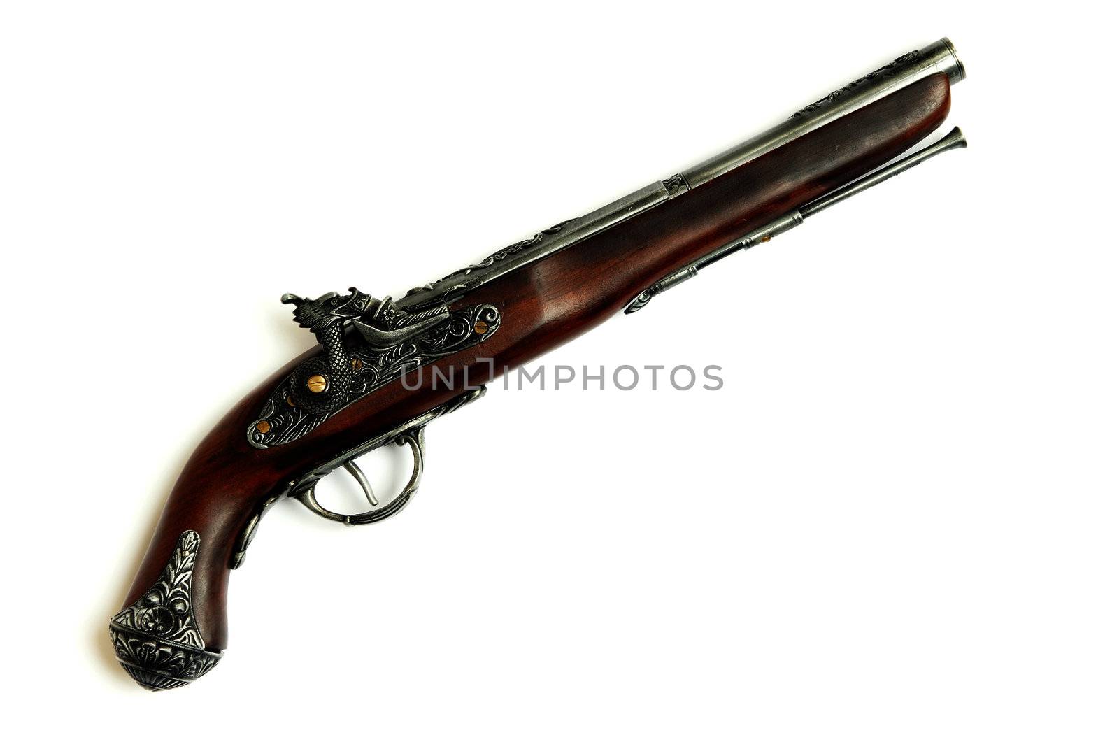 Close-up photo of the ancient pirate pistol on a white background