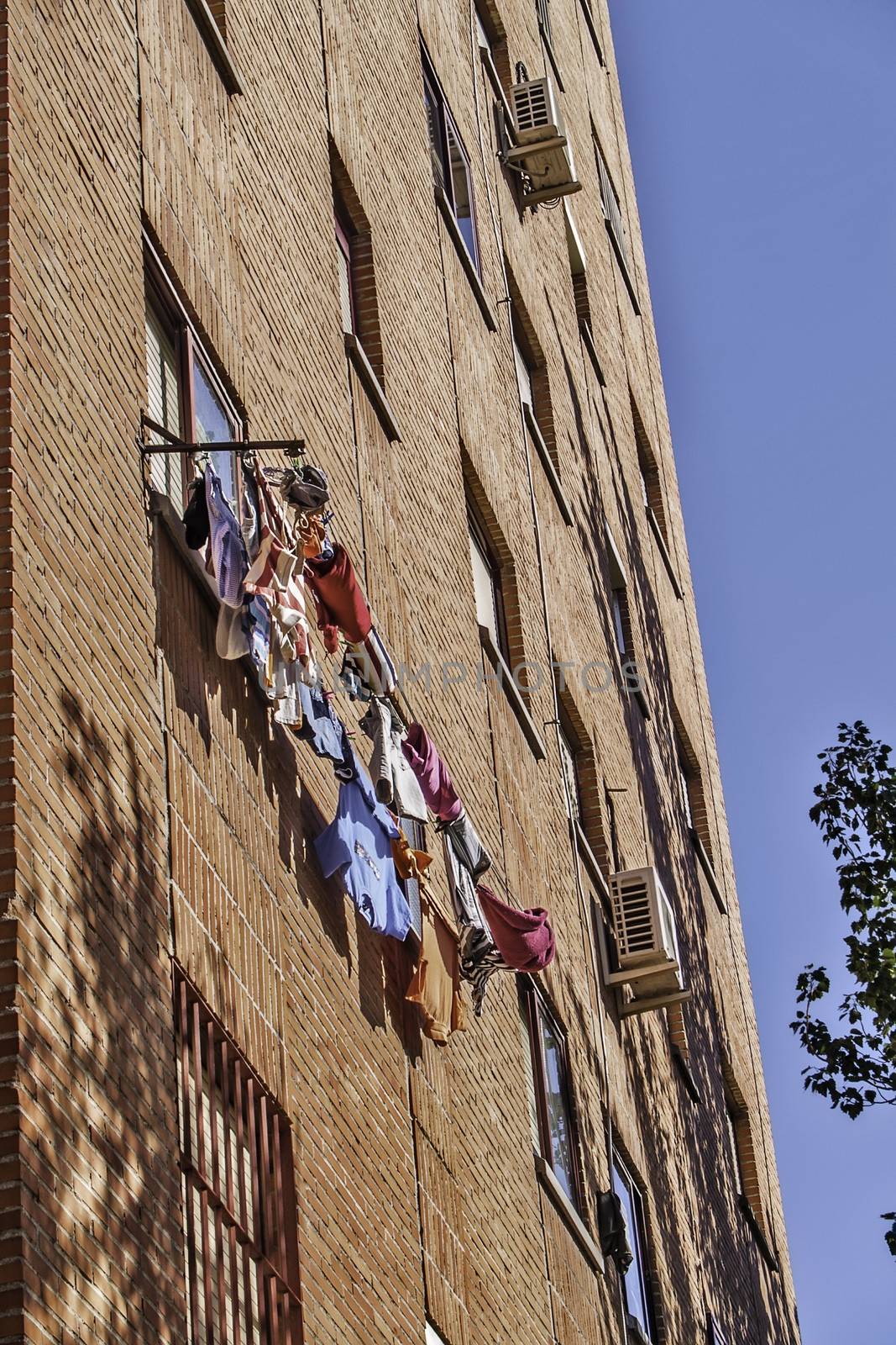 Madrid, August 2012. Laundry drying on a window in a residential building