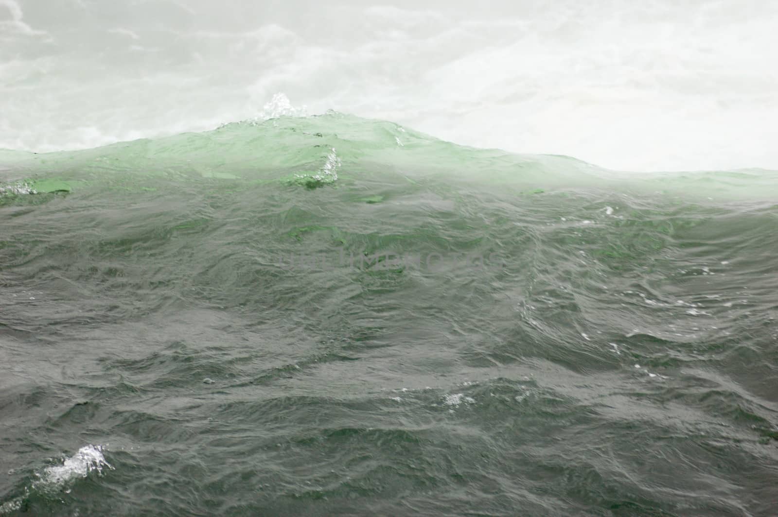 Blue-green water, falling down from Niagara falls.