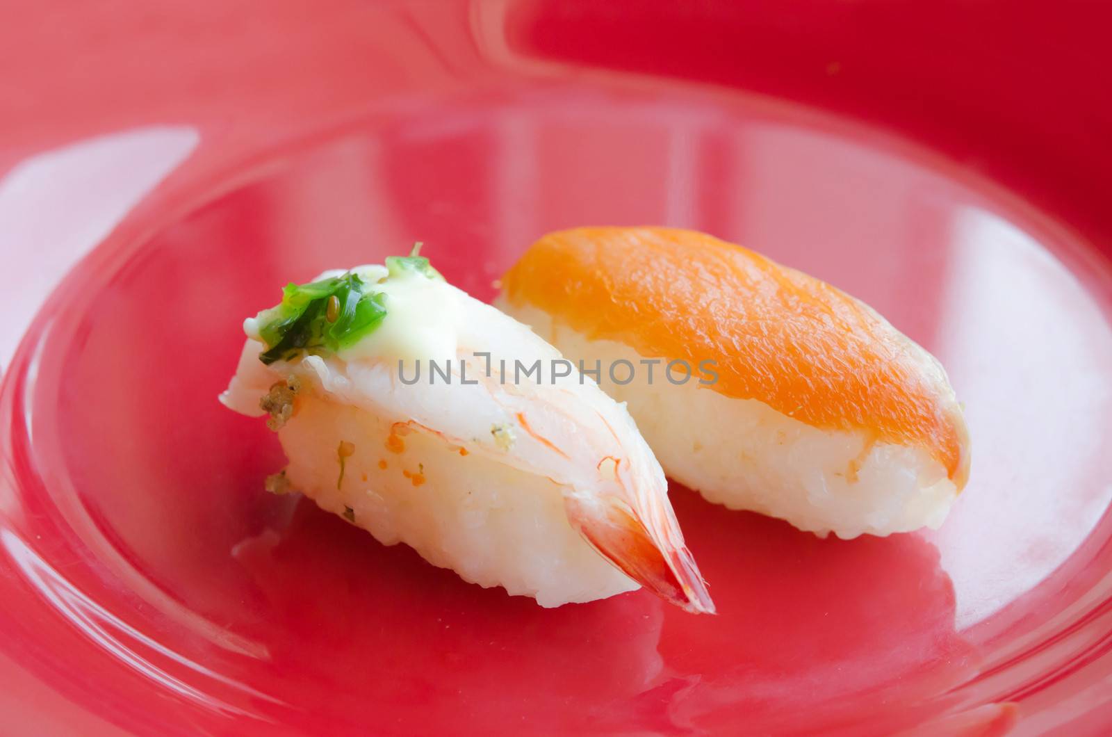 Sushi with Shrimps and  sushi with salmon on red dish
