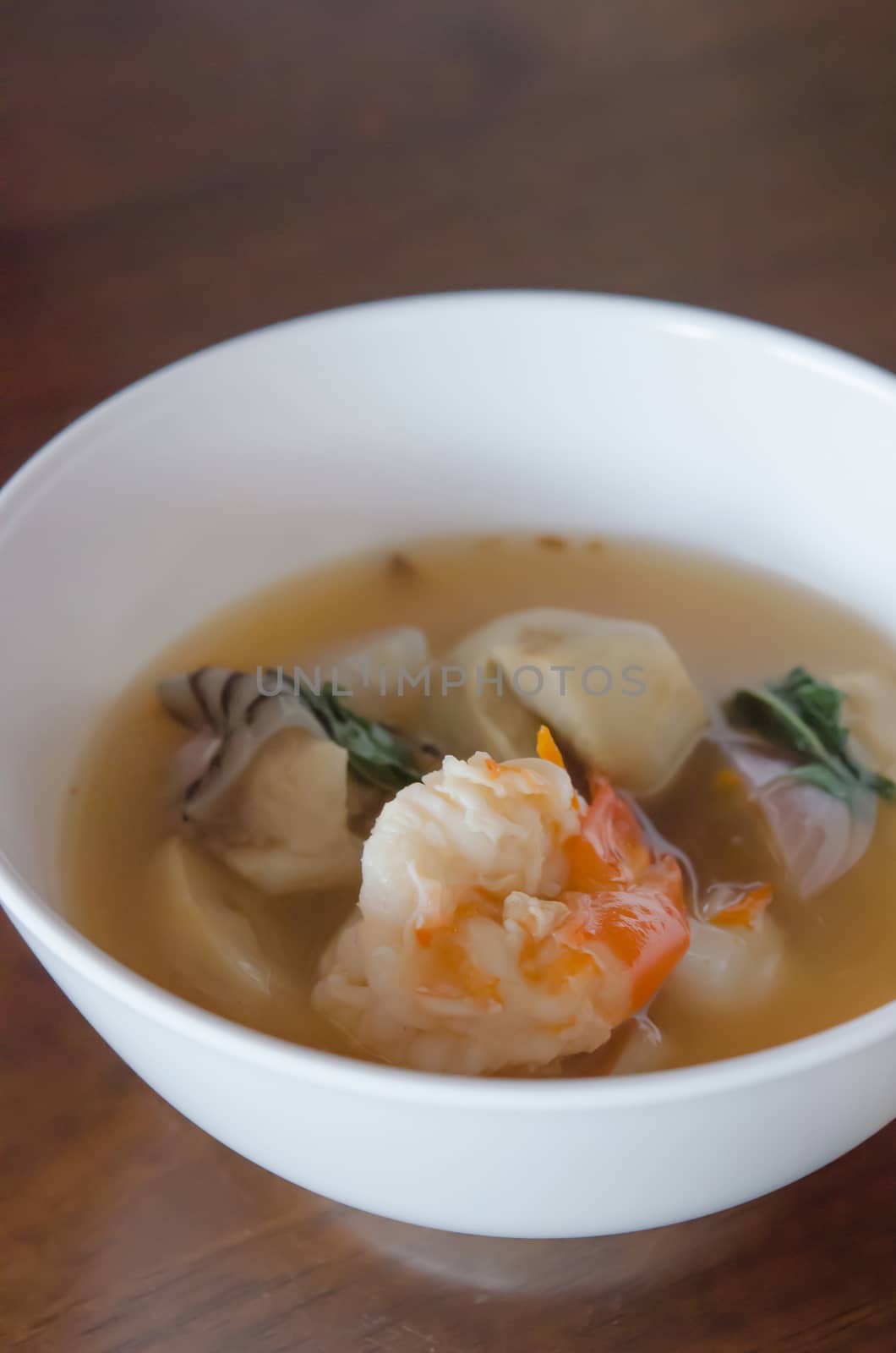 Tom Yum Goong - Thai hot and spicy soup seafood with shrimp in white bowl