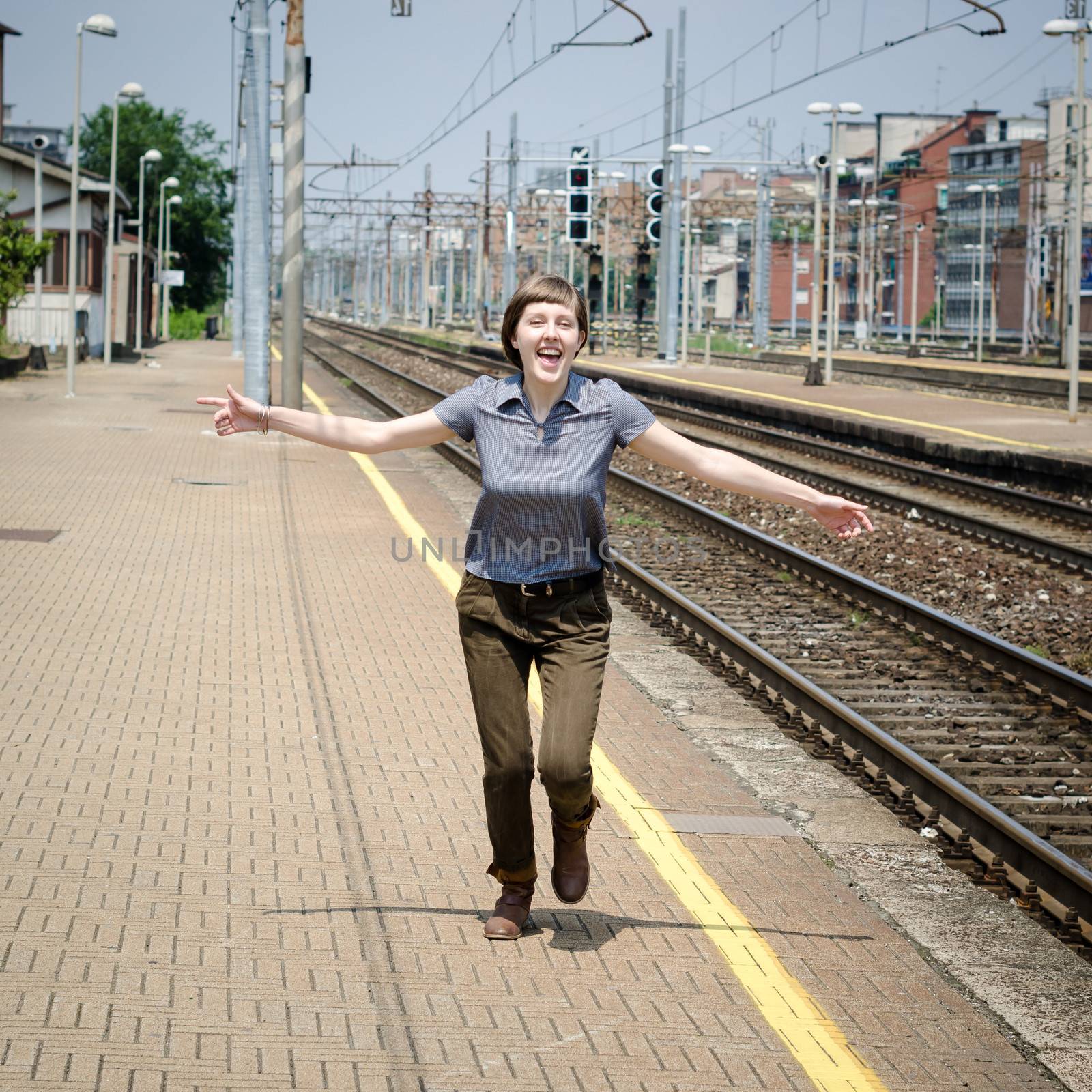 young beautiful hipster woman happy running by peus