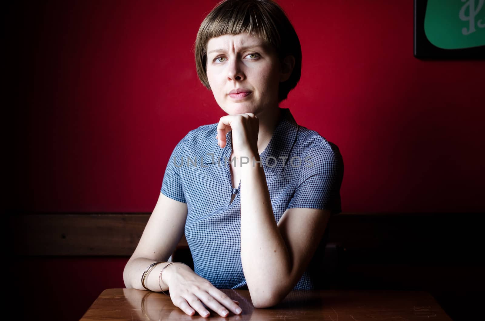 young beautiful hipster woman at the bar