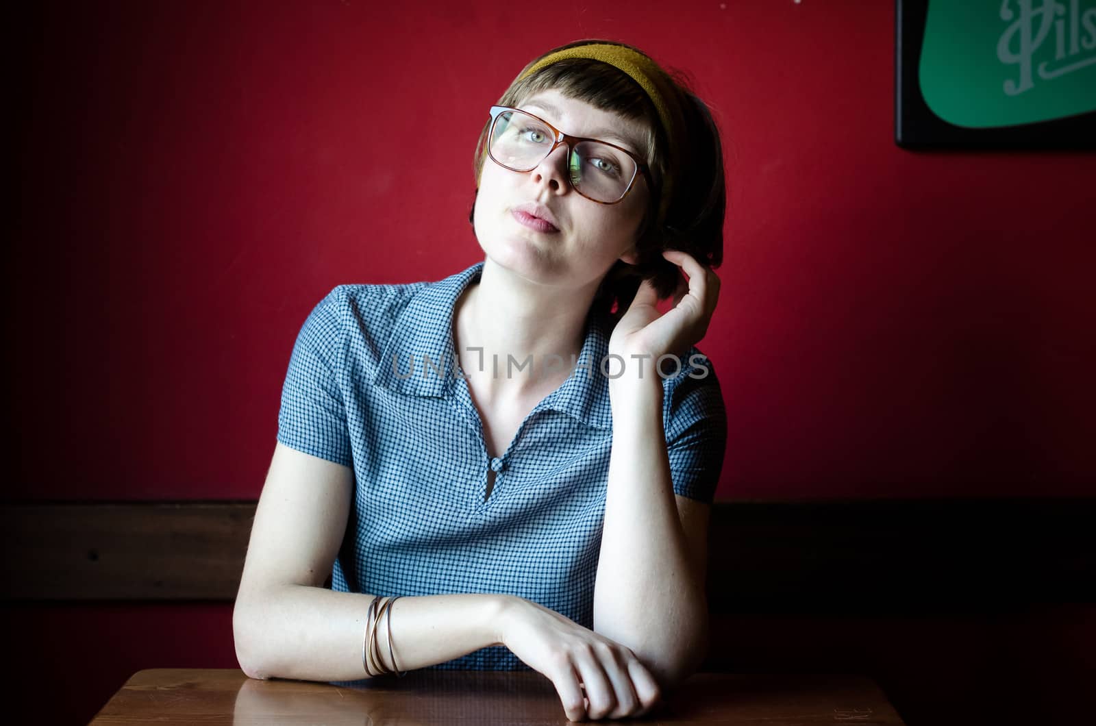 young beautiful hipster woman at the bar