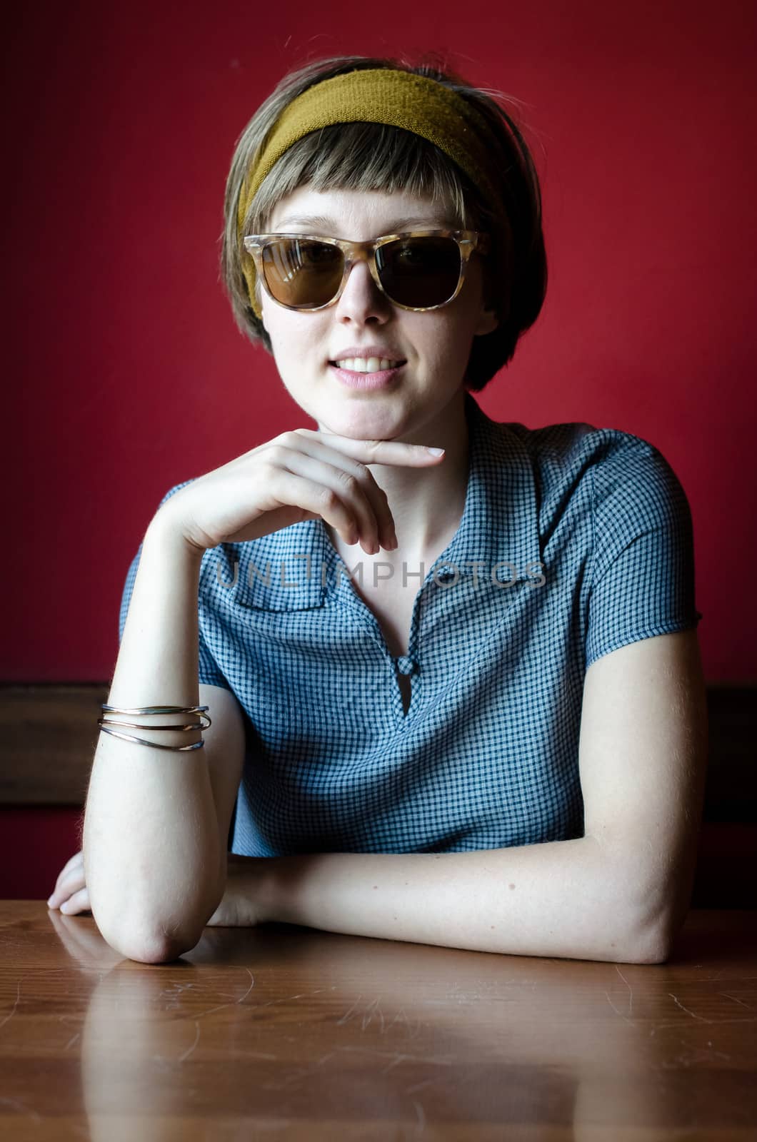 young beautiful hipster woman at the bar