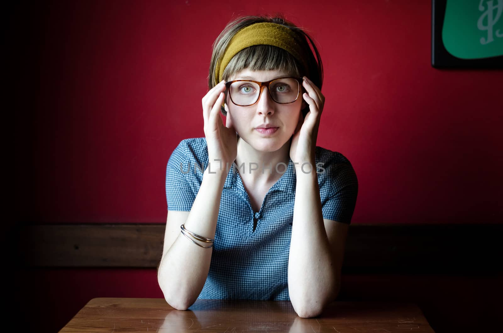 young beautiful hipster woman at the bar