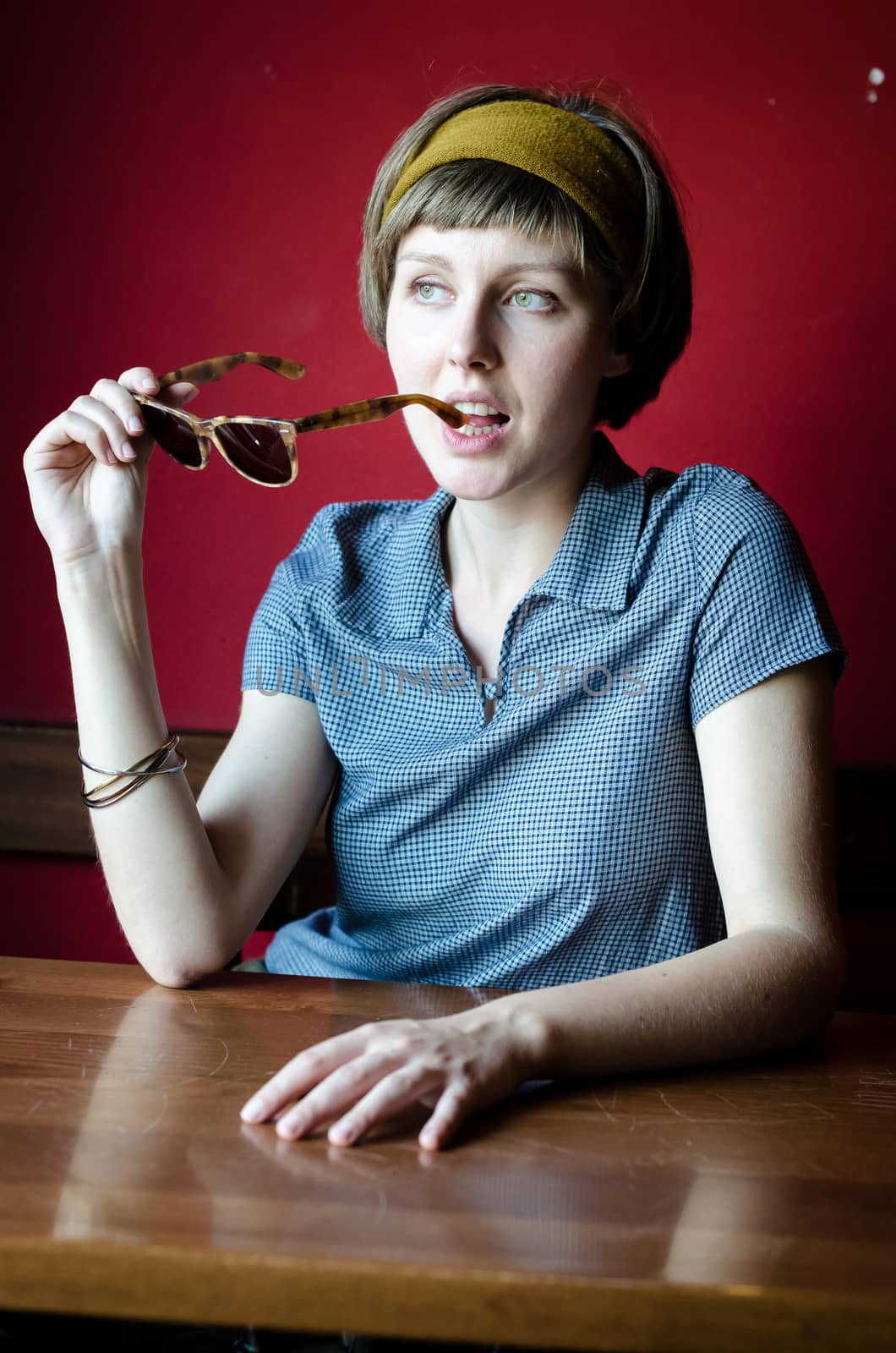 young beautiful hipster woman at the bar