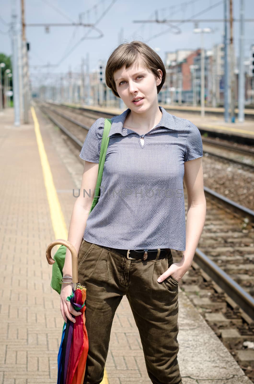 young beautiful hipster woman in railway station