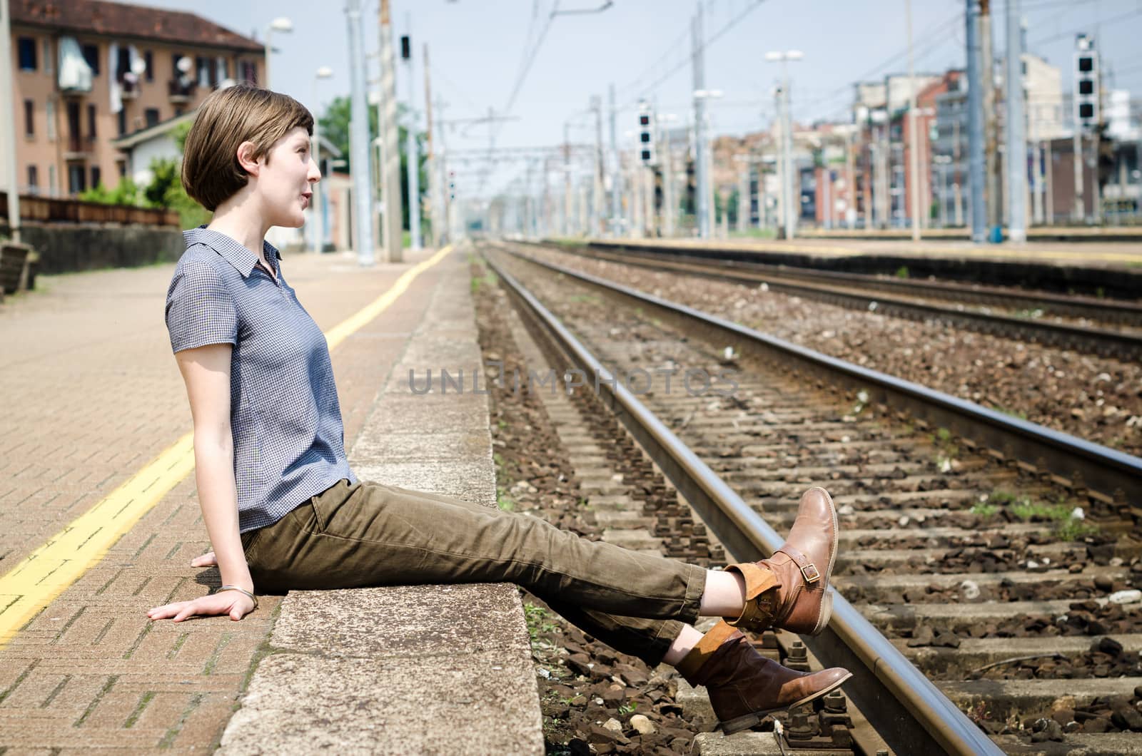 young beautiful hipster woman at the station