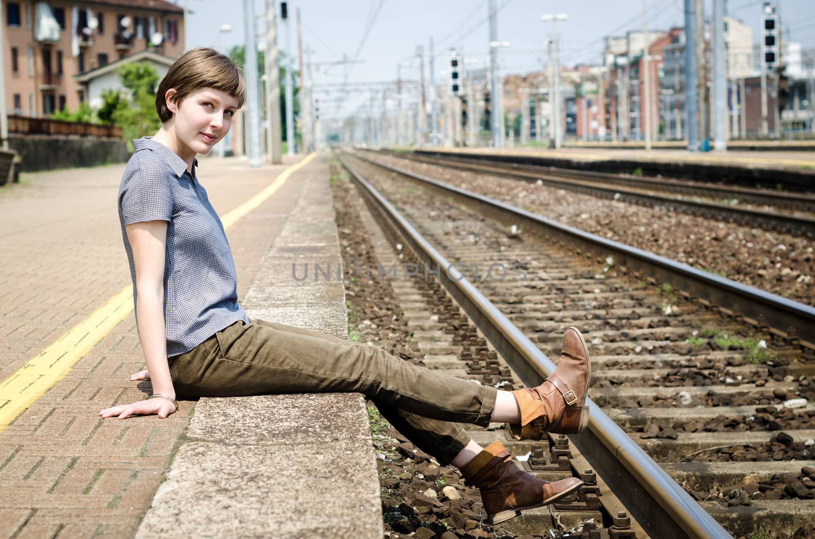 young beautiful hipster woman at the station