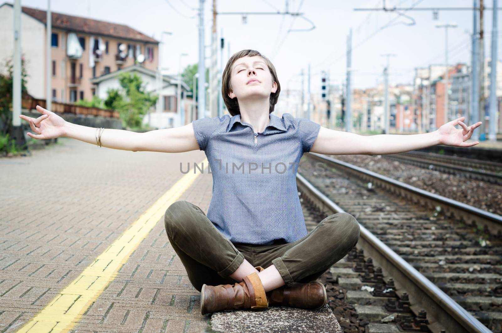 young beautiful hipster woman at the station