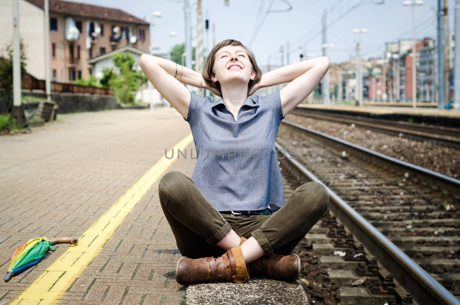 young beautiful hipster woman at the station