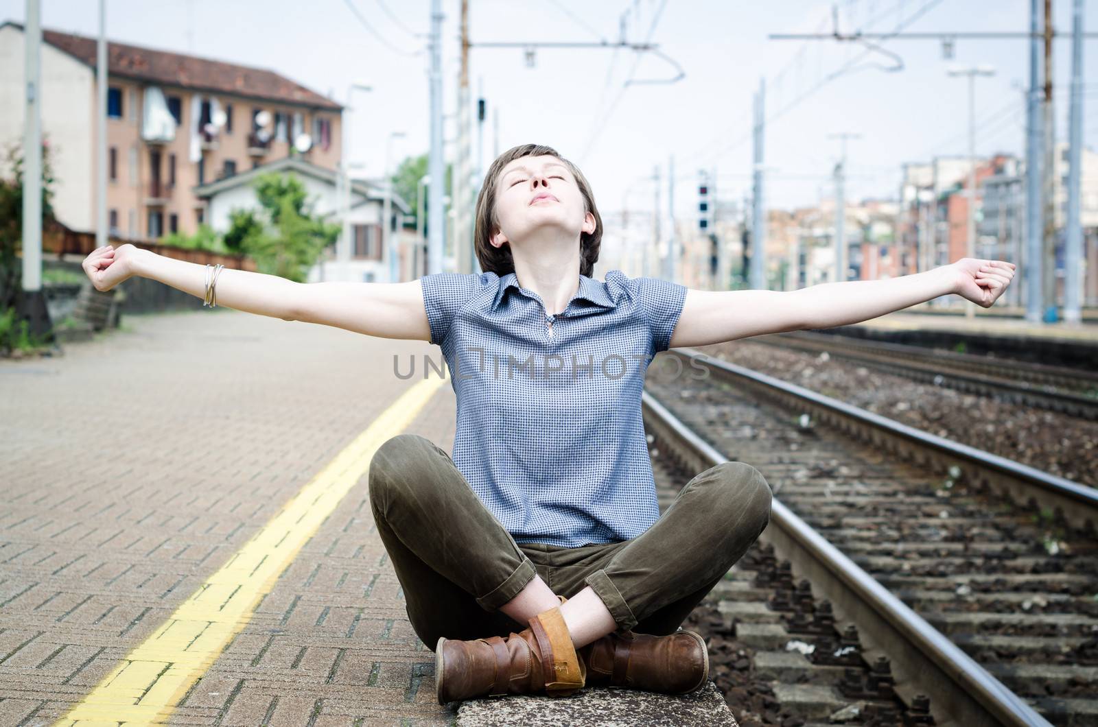 young beautiful hipster woman at the station