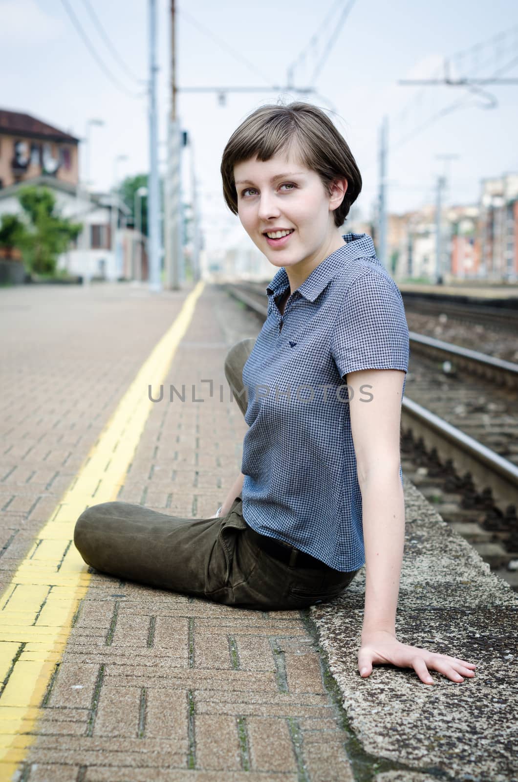 young beautiful hipster woman at the station