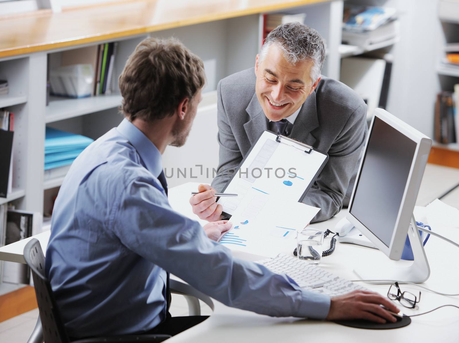 Business colleagues discussing together in an office