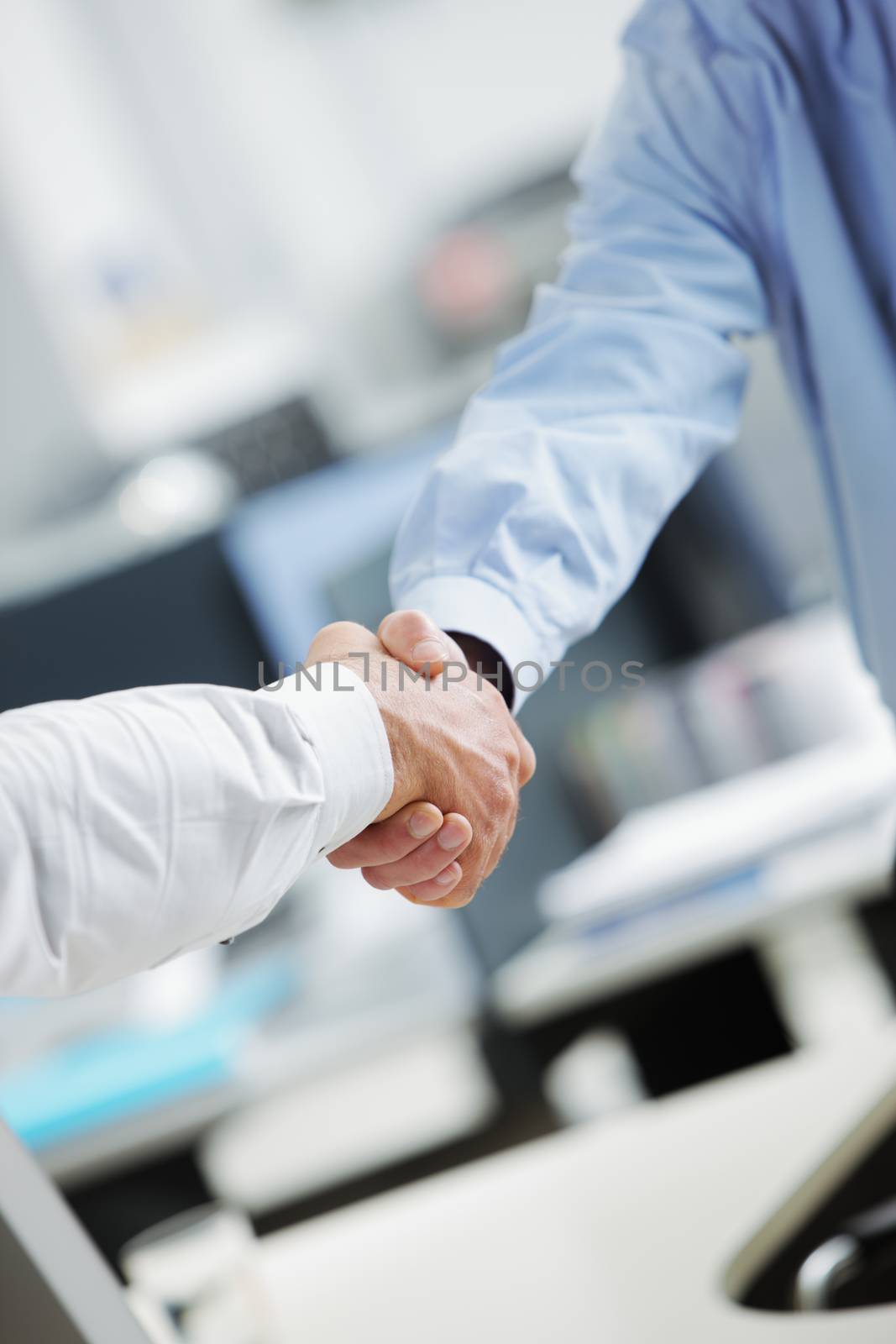 Business deal. Close up of a handshake
