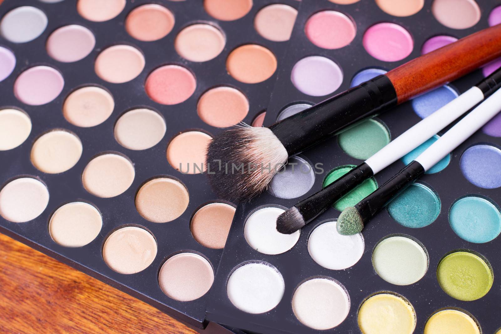 Colorful set of professional eye shades wit brushes