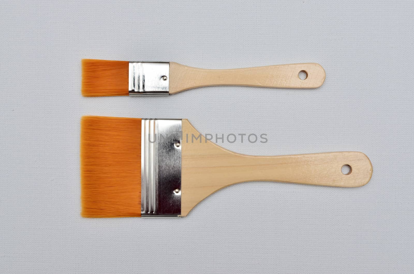 new paint brushes on canvas background by DNKSTUDIO